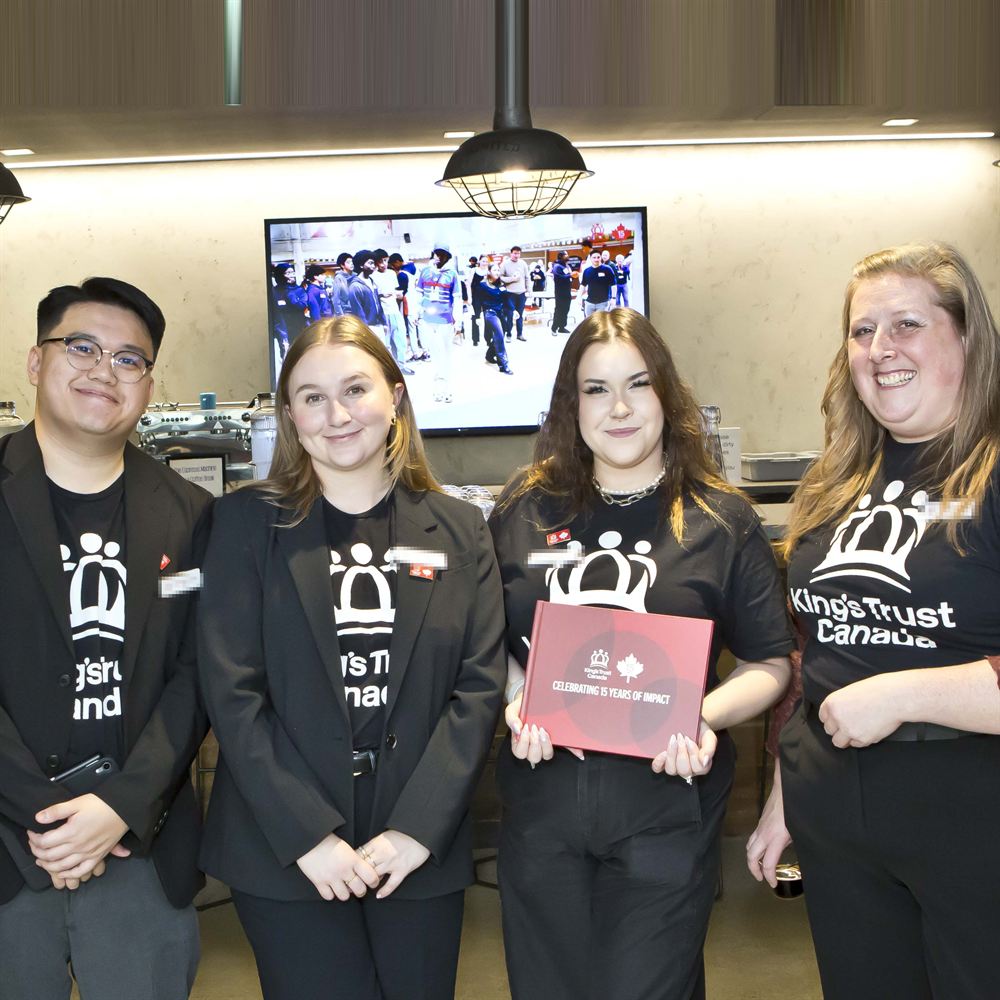 Members of The King’s Trust Canada team smiling together at a past event.